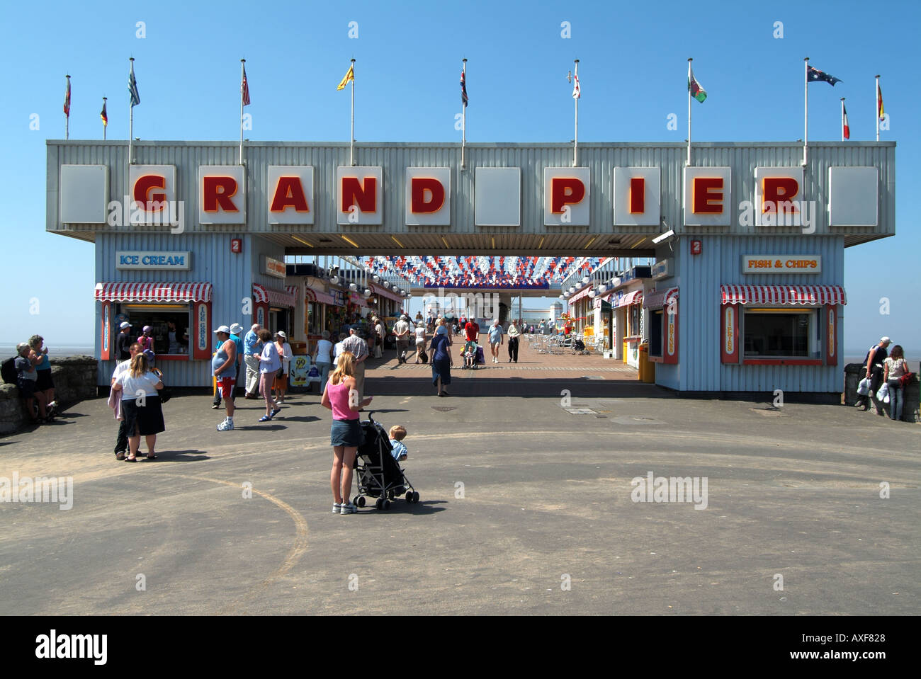 Weston Super Mare Grand Pier entrance with holidaymakers Stock Photo - Alamy