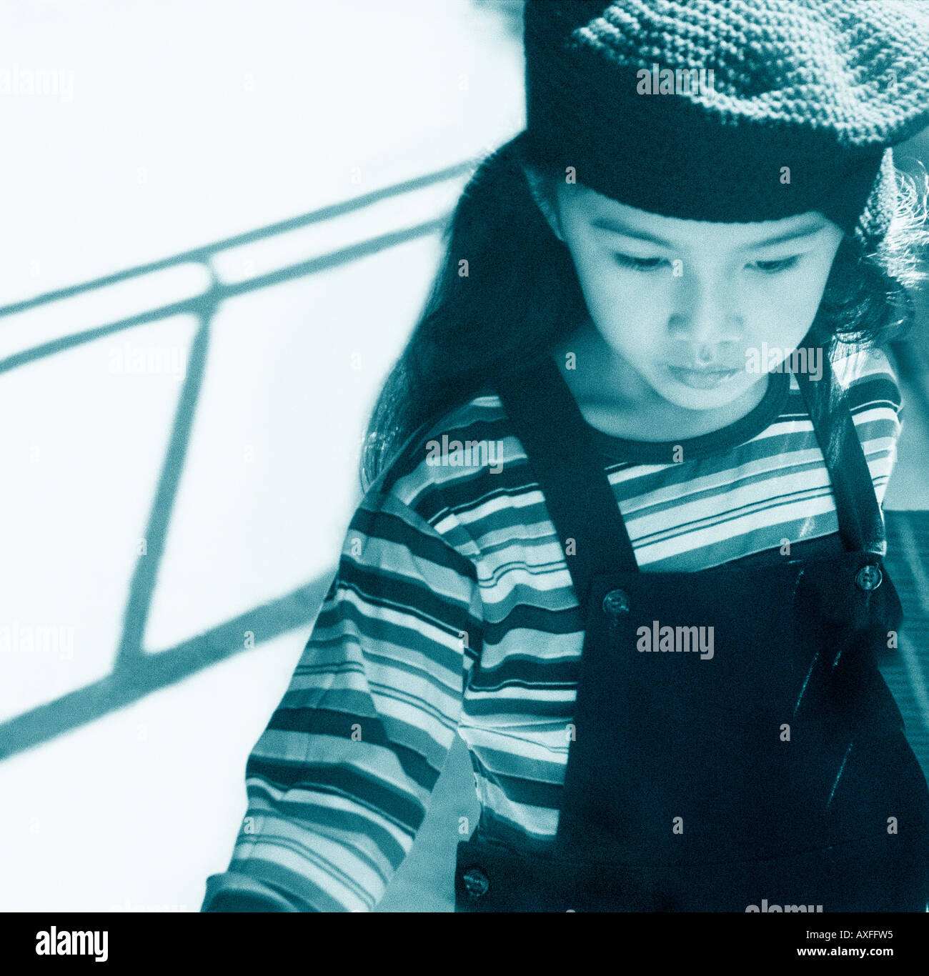 Five year old girl looking down while walking Stock Photo Alamy