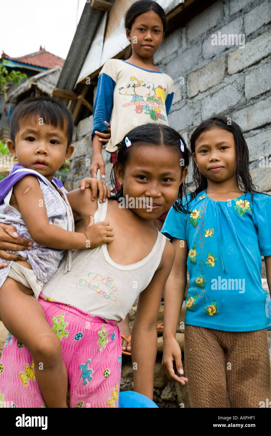 Young girls greet visitors in the small coastal town of Amed Bali ...