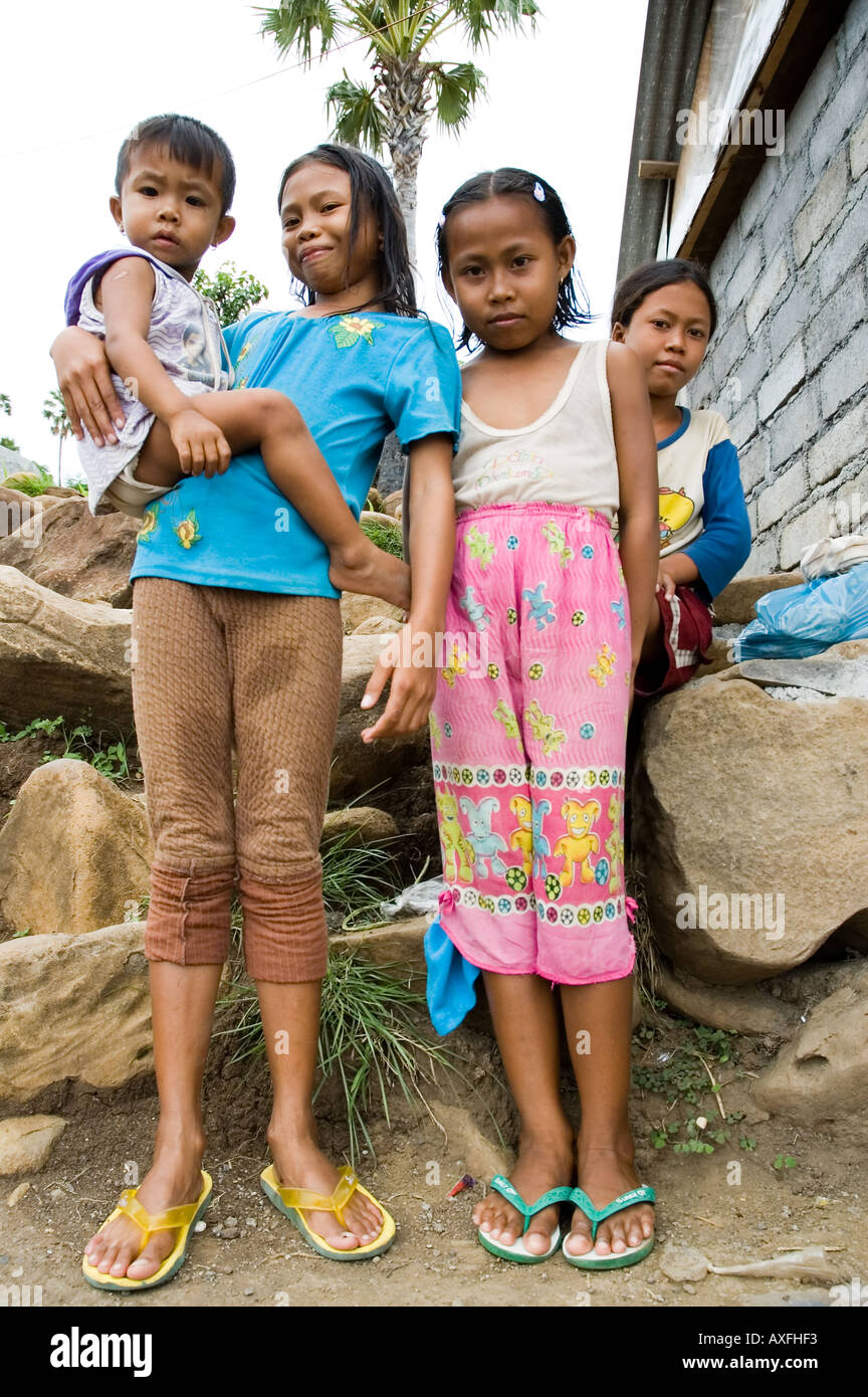 Young girls greet visitors in the small coastal town of Amed Bali ...