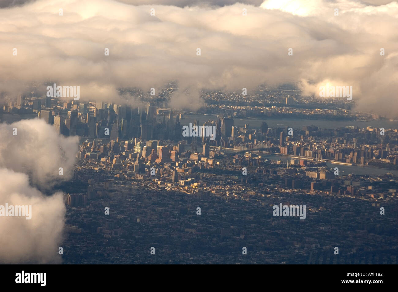 An aerial view of New York City with some clouds surrounding the ...