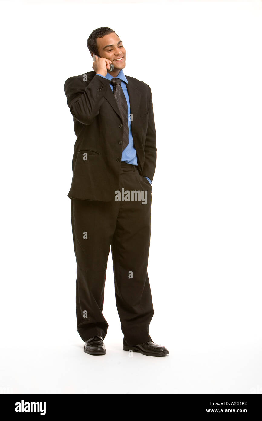 Young business man smiling while talking on the phone Stock Photo