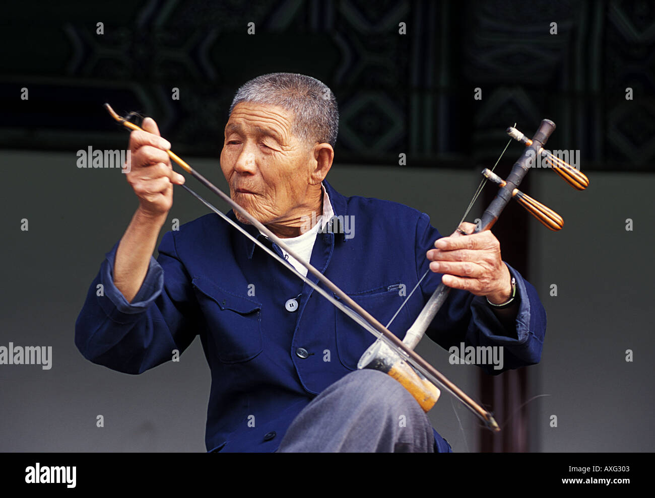 Musician playing a Erhu with a bow Beijing China Stock Photo Alamy
