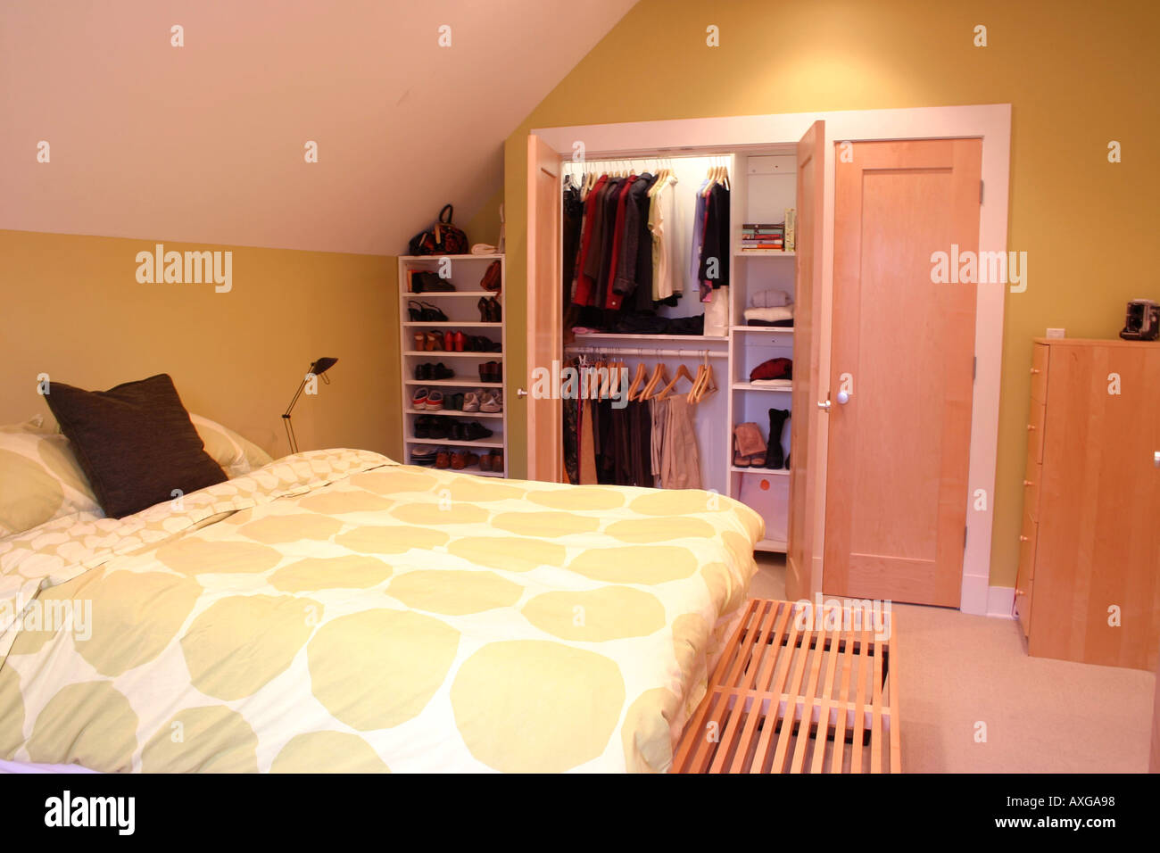 Modern bedroom with super organized closet Stock Photo