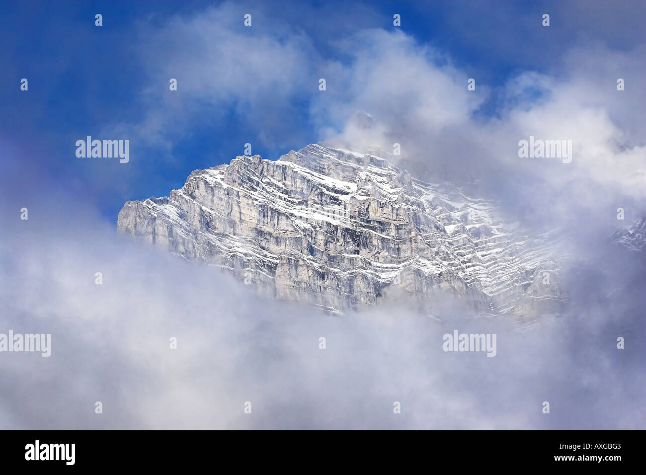 Mountain shrouded in clouds hi-res stock photography and images - Alamy