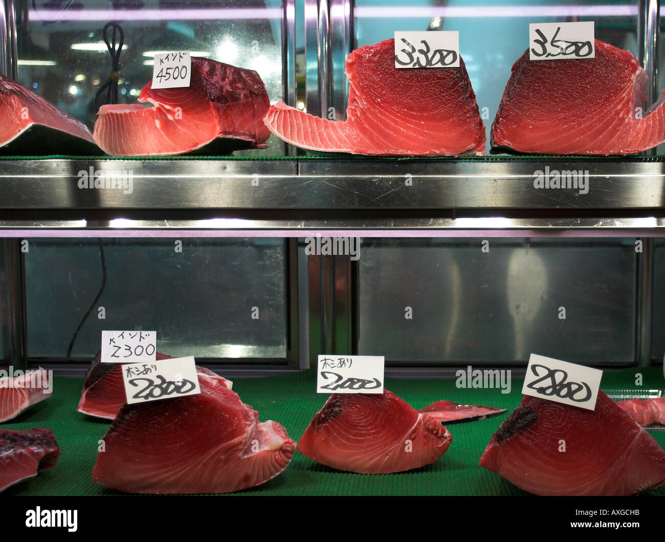 Tuna steaks for sale on a market stall at Tokyo fish market Stock Photo