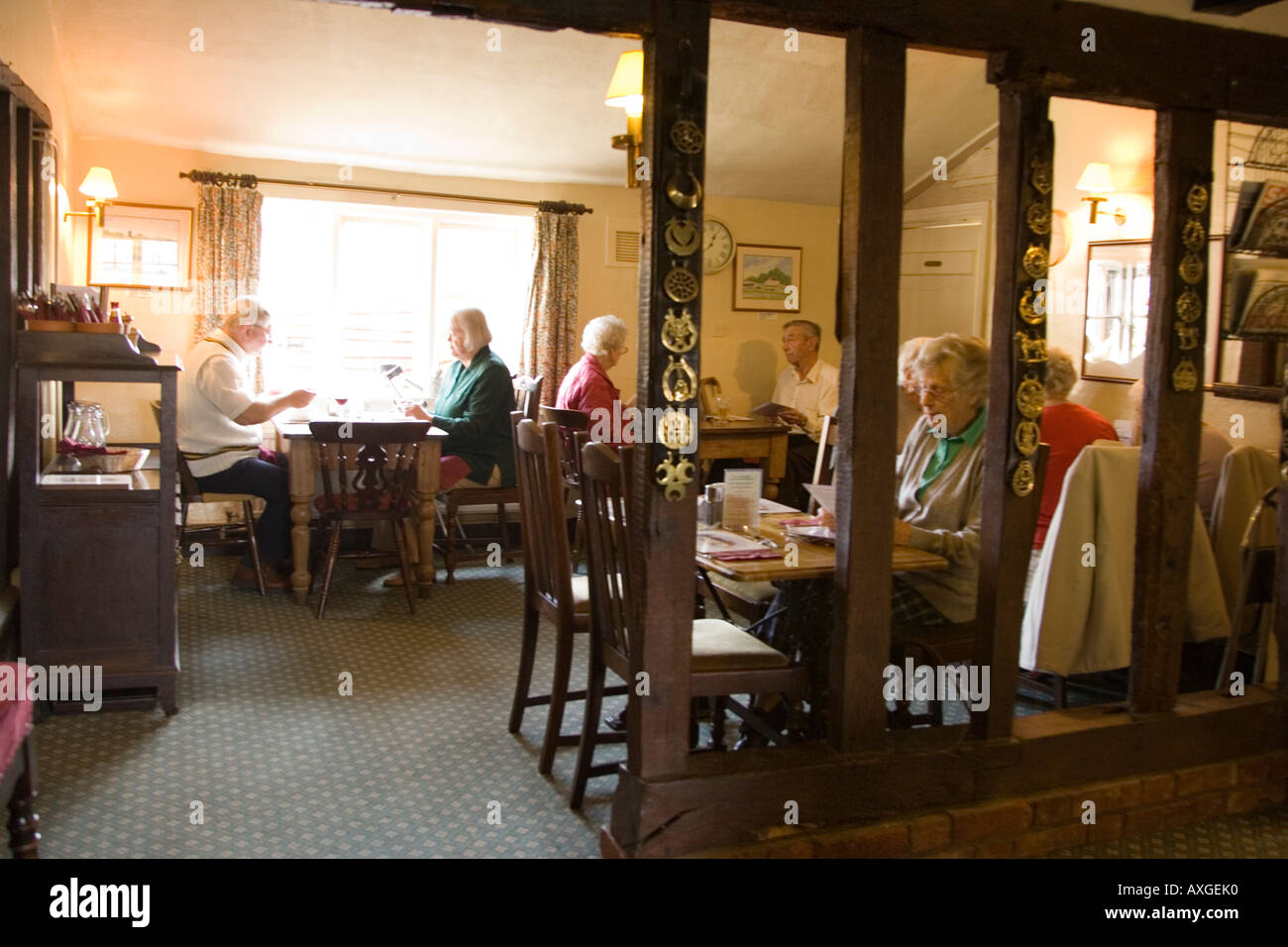 people having a meal at The Gardeners Arms pub in Tostock in Suffolk, UK Stock Photo