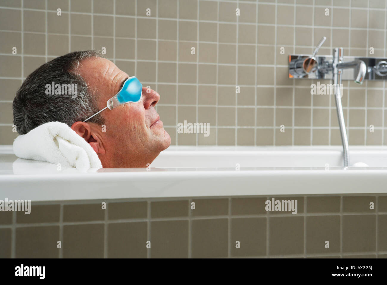 Senior man bathing in bathtub High Resolution Stock Photography and