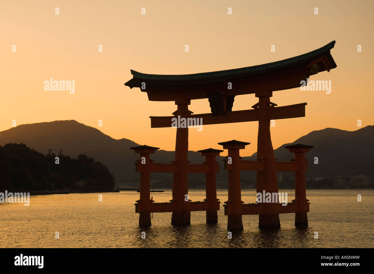 Torii Gate at Dusk, Hiroshima Bay, Miyajima, Honshu, Japan Stock Photo