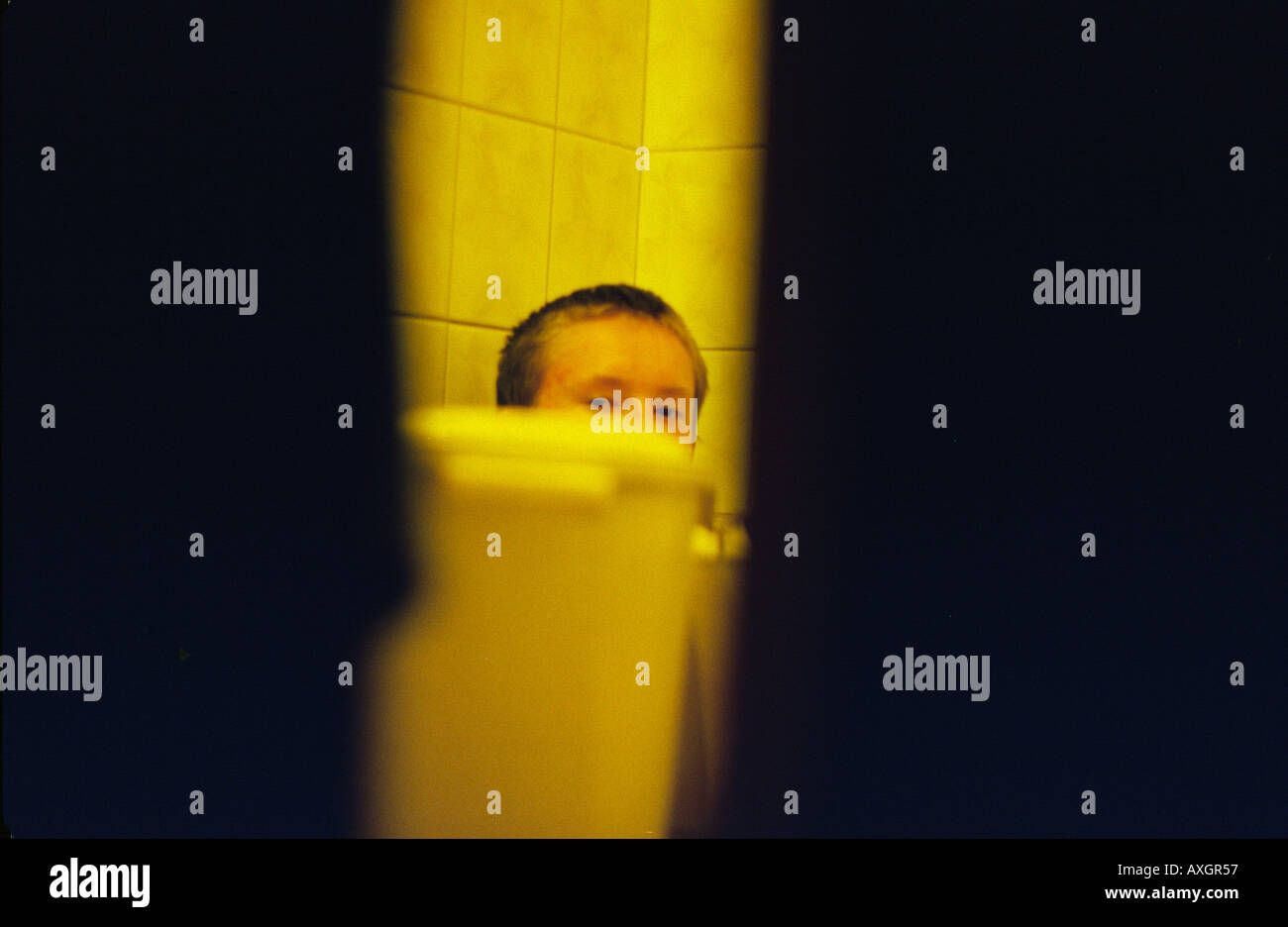 Boy hiding bathroom hires stock photography and images Alamy