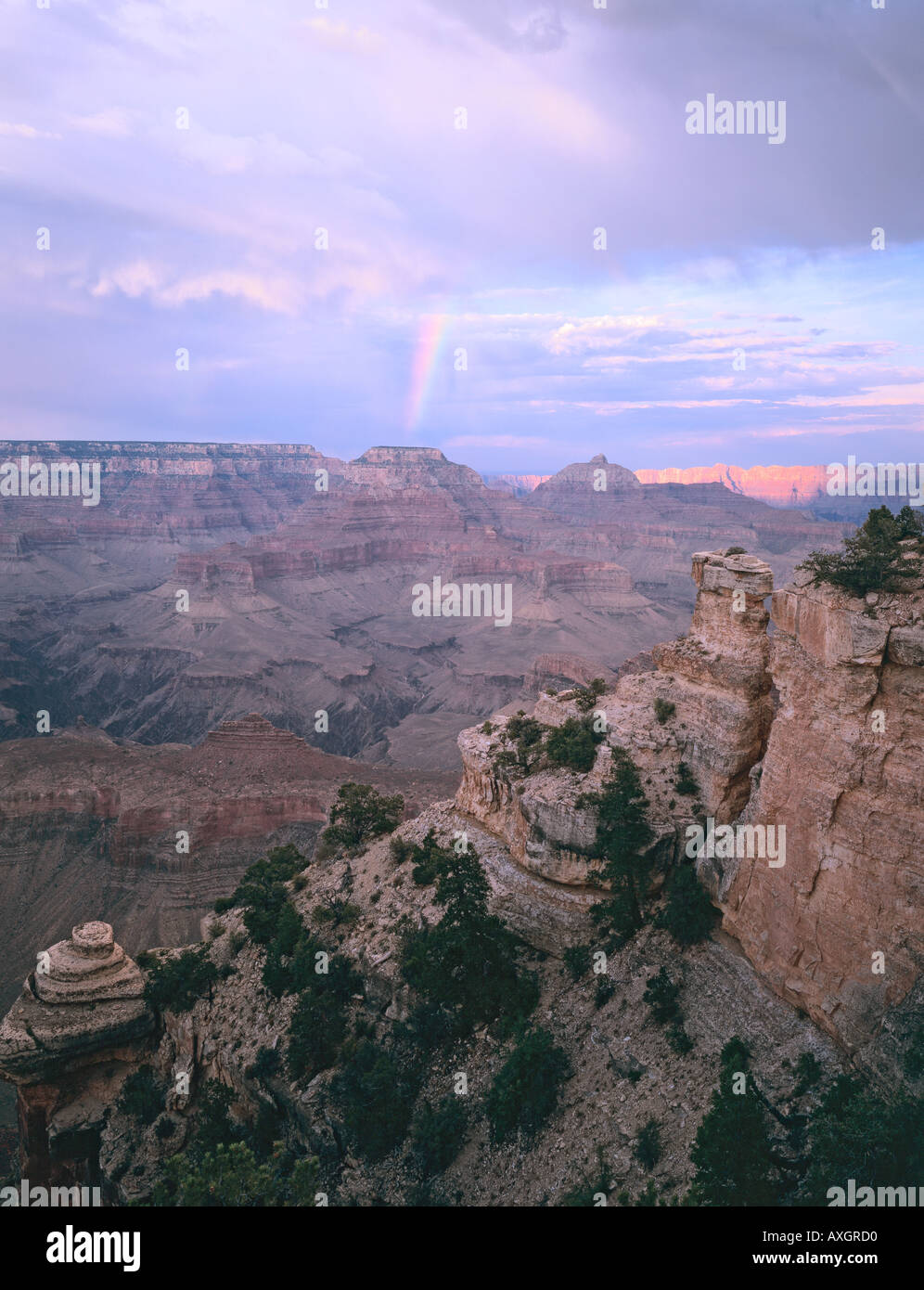 A rainbow forms over the Grand Canyon during summer monsoon season ...
