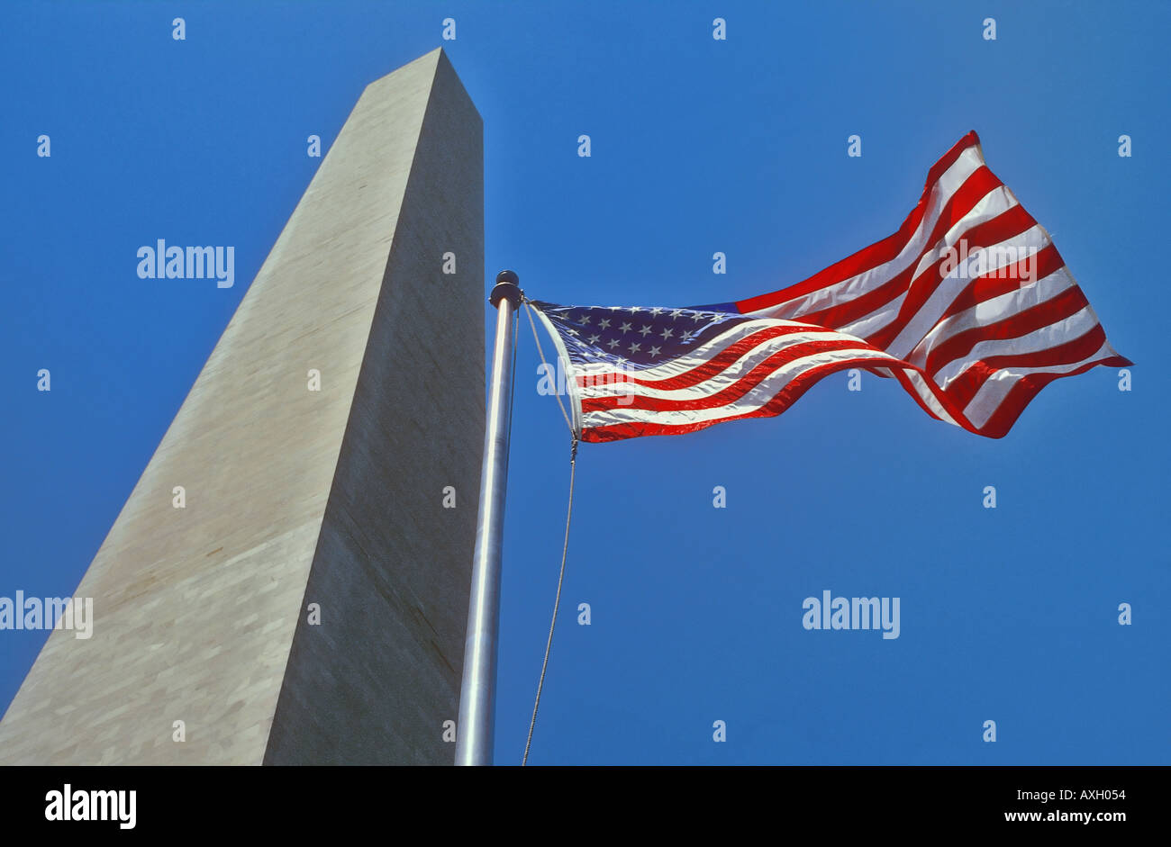 Stars and Stripes US flag at the foot of The Washington Memorial Washington DC USA Stock Photo