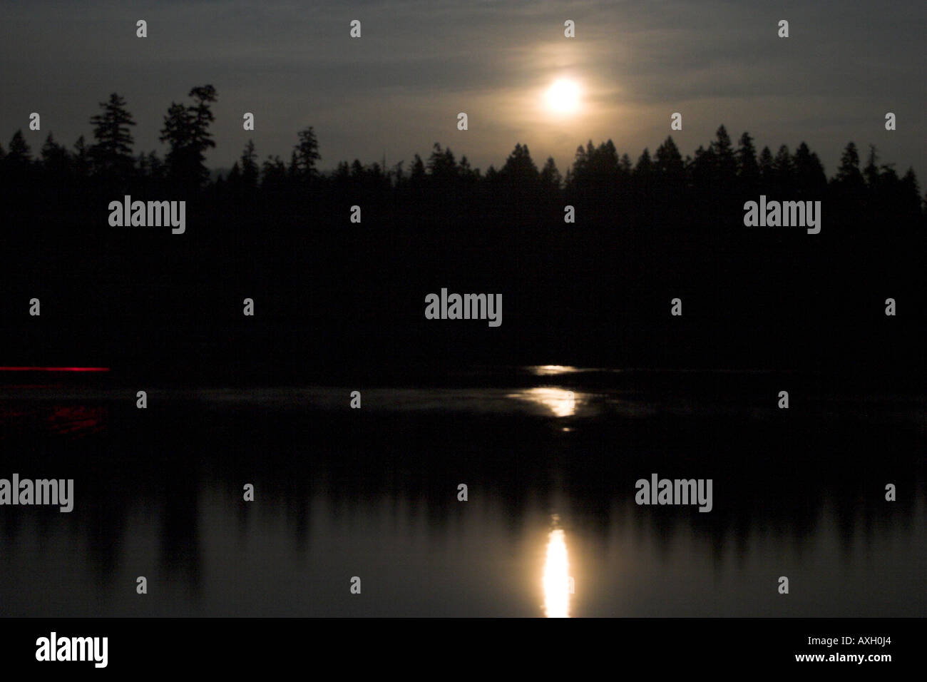 Moonrise at Clear Lake Near Santiam Pass, Oregon Cascades Stock Photo