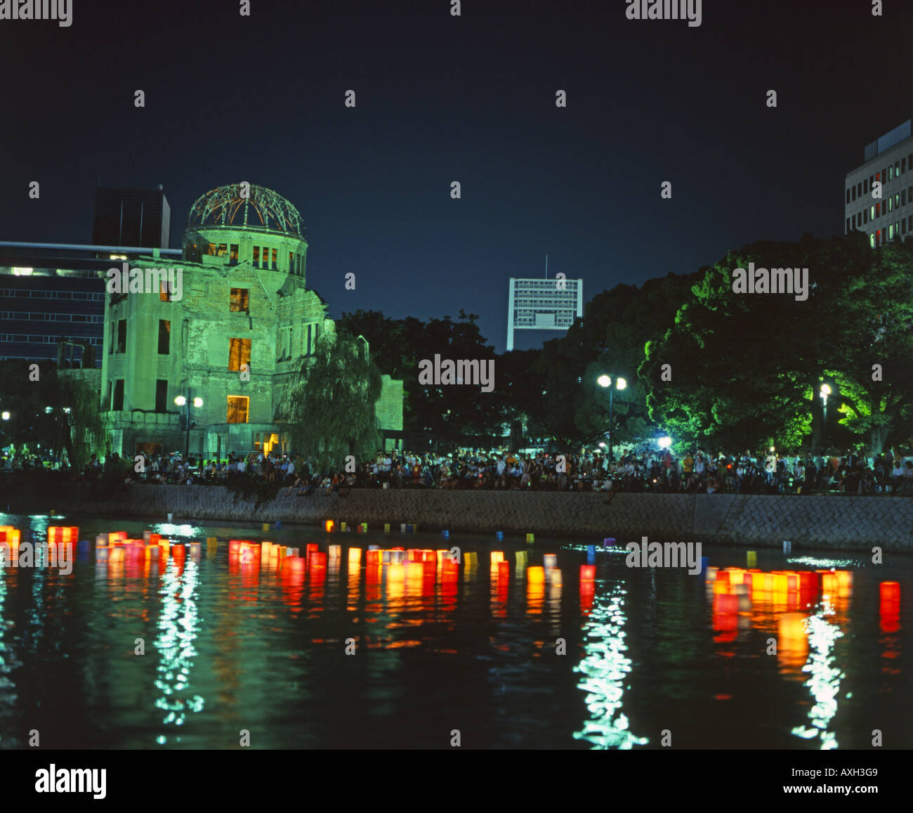 Floating lanterns on August 6th, Hiroshima, Japan. Placed in the river beside the A-Bomb Dome ( a UNESCO World Heritage Site. ) Stock Photo