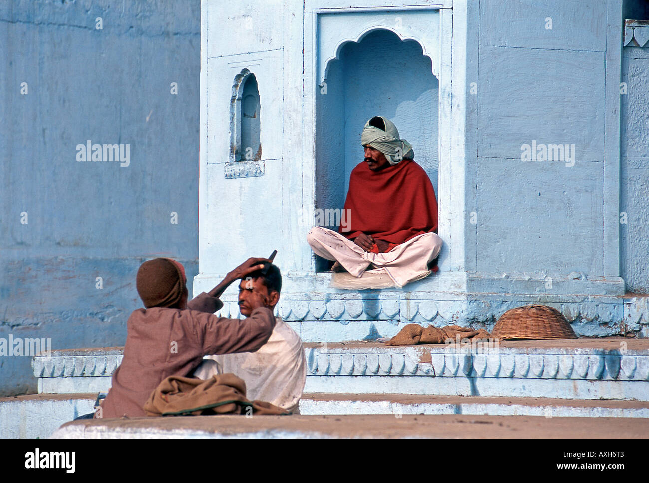 Relative of passed away person being shaved for cremation ceremony Varanasi India Stock Photo