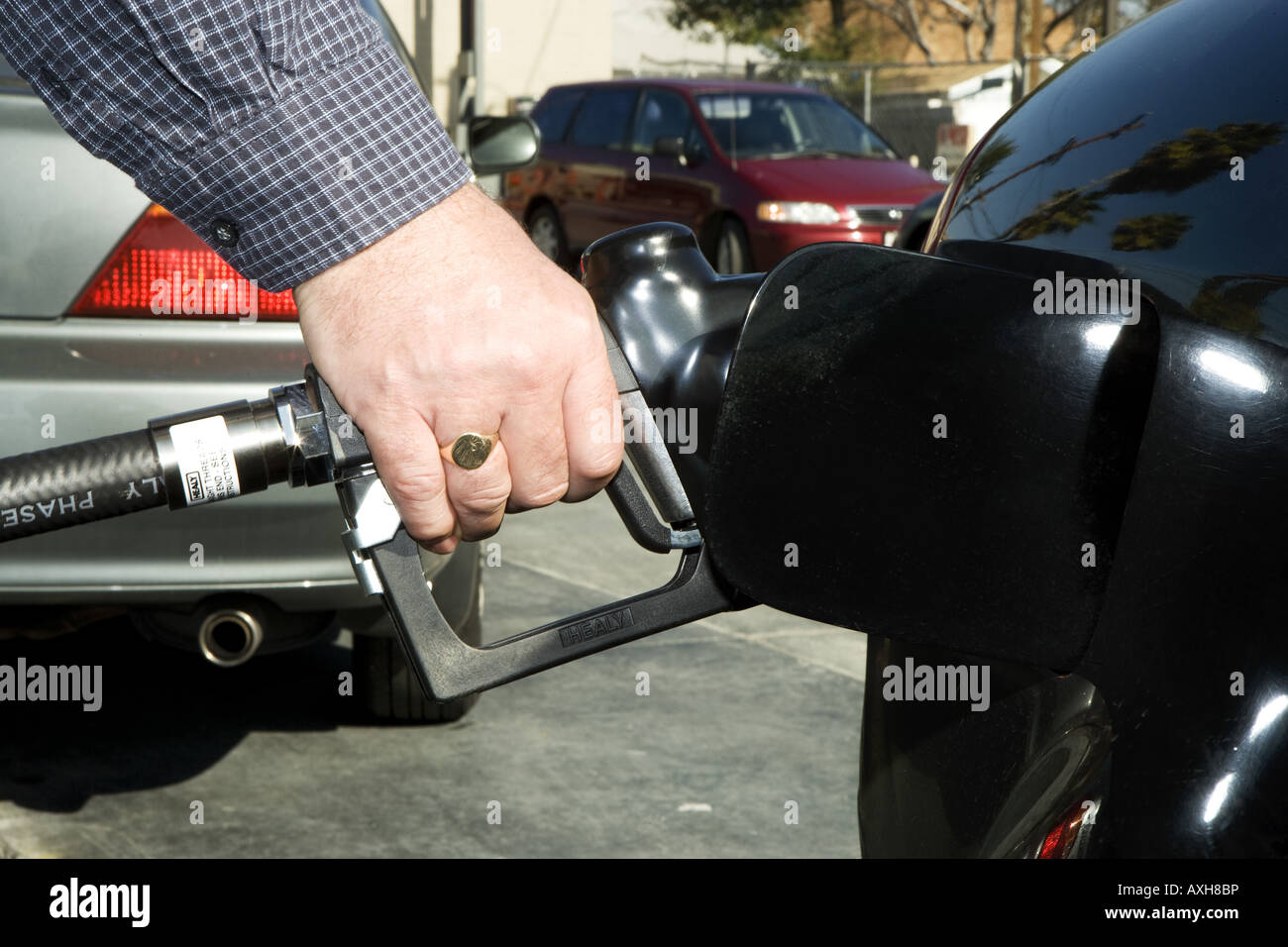 Man pumping gas into tank Stock Photo Alamy