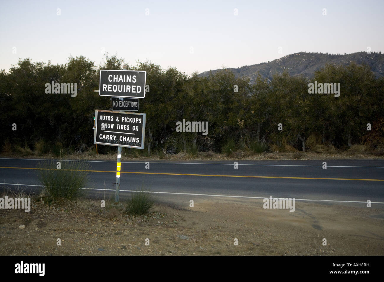 "Chains Required" sign along mountain road Stock Photo Alamy