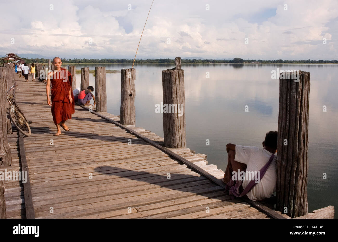 Stock photograph of the U Bein old teak bridge across Taungthaman Lake ...