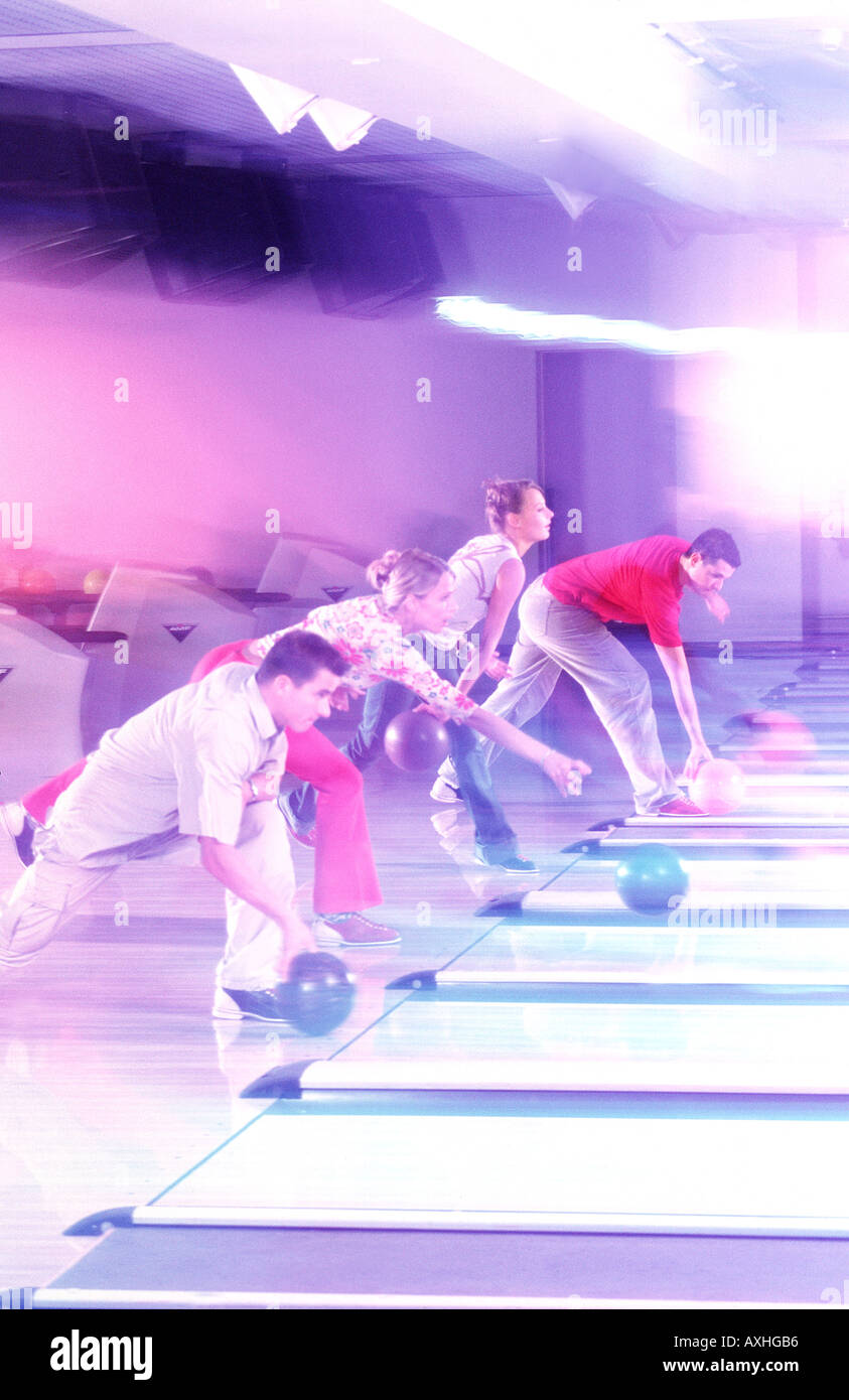 A group of young people having fun at a bowling-alley. Stock Photo