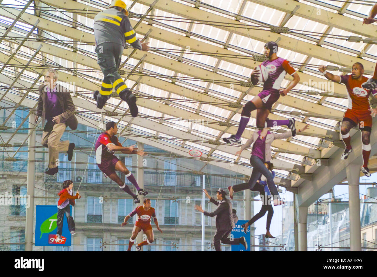 Suspended rugby playing figures at Gare du Nord Paris to celebrate the Rugby World Cup Stock Photo