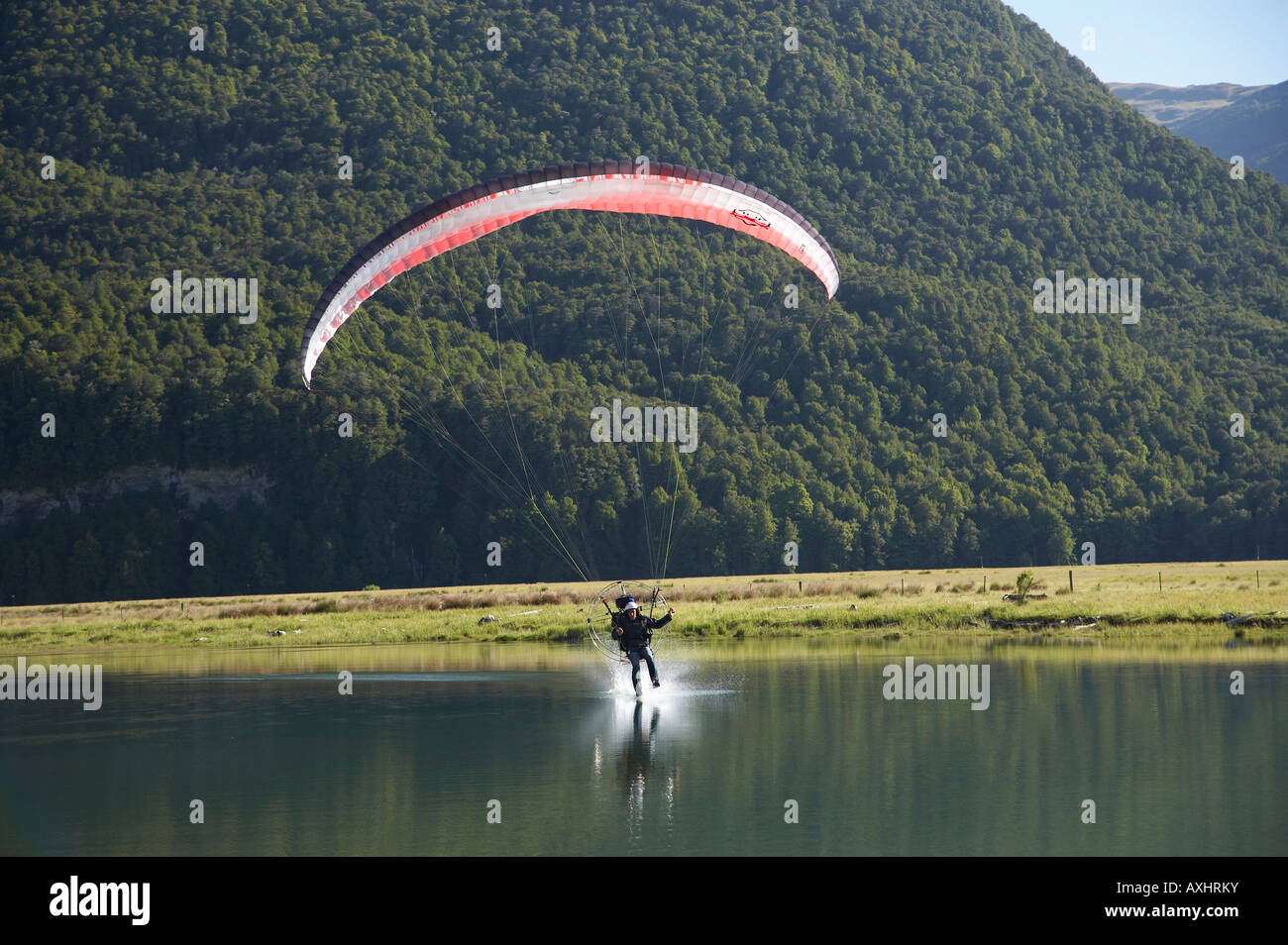 Paramotor skimming water Diamond Lake Paradise near Glenorchy