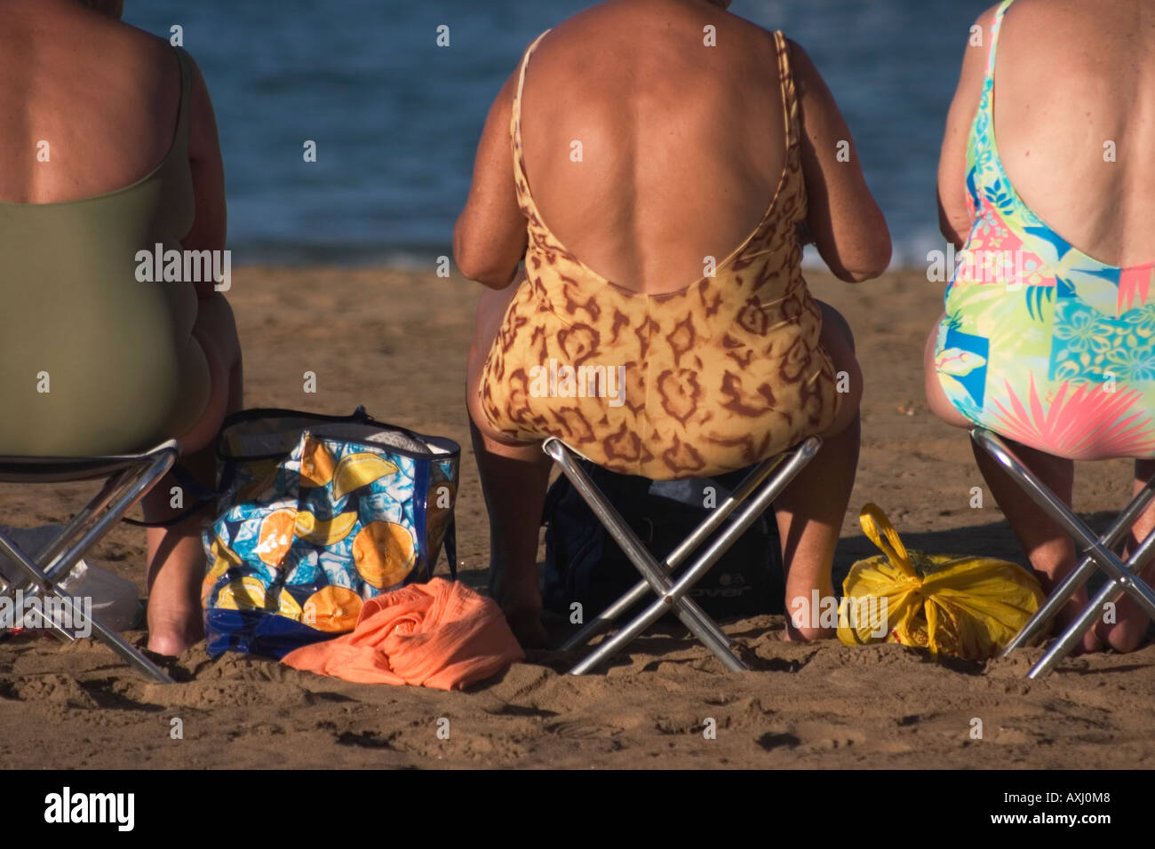 Elderly woman swimming costume beach hi-res stock photography and 