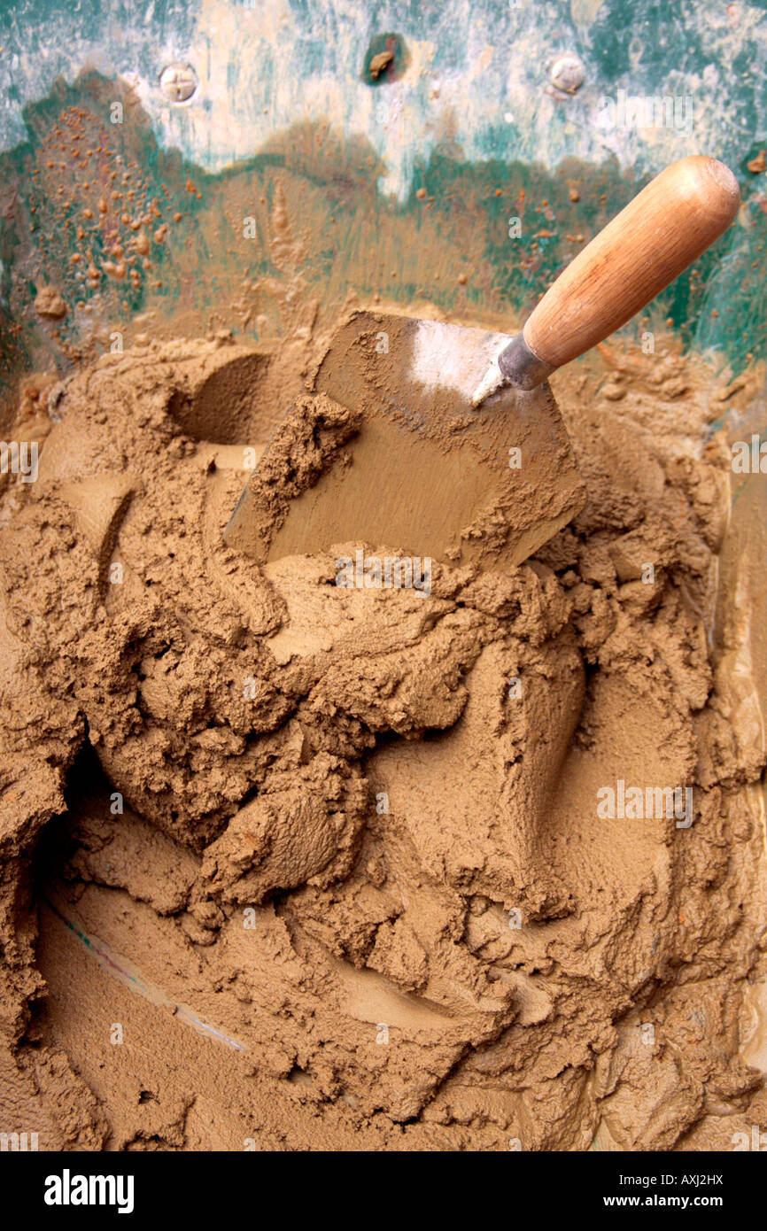 Trowel and mortar in a wheelbarrow Stock Photo Alamy