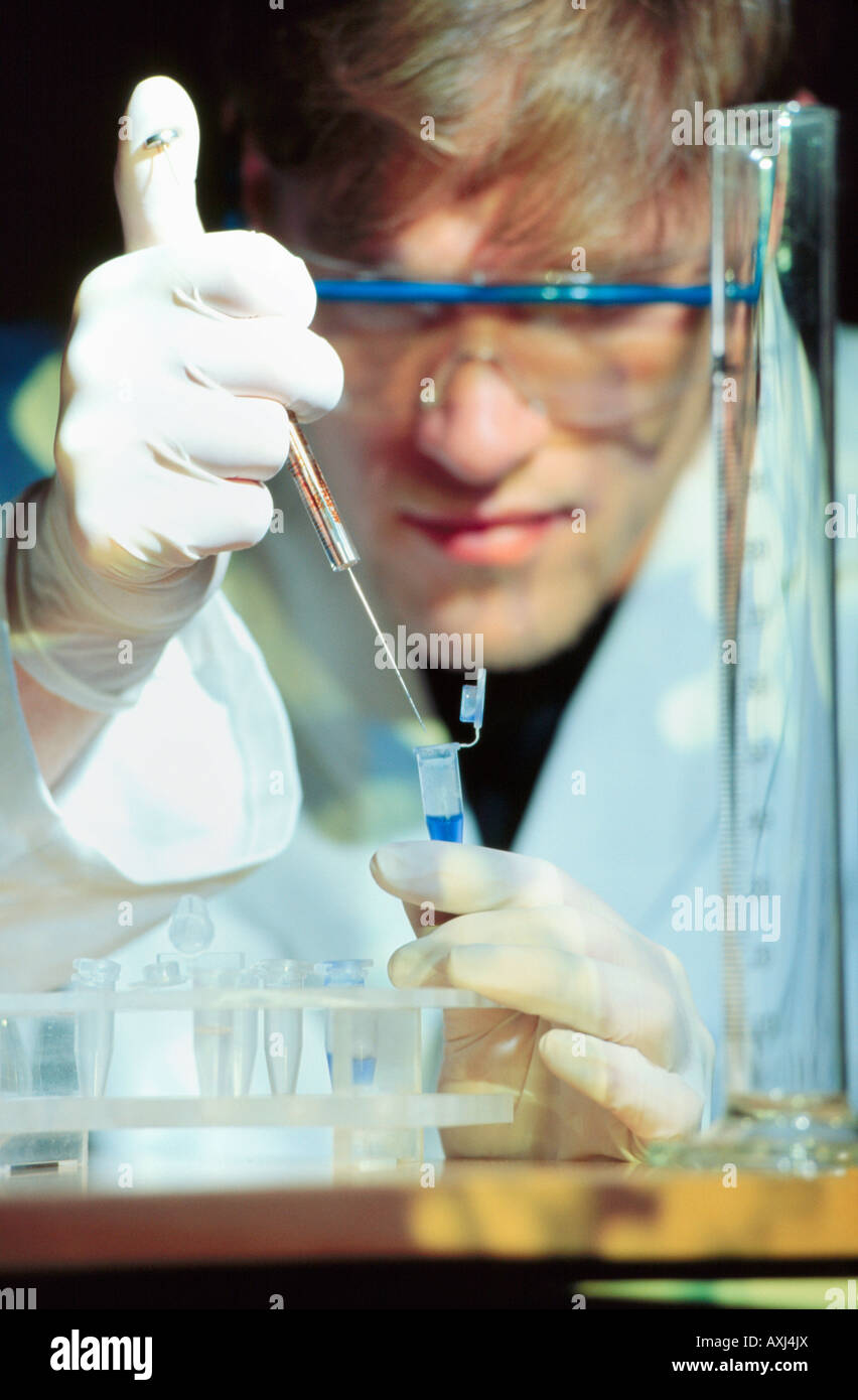 reseracher molecular biology handling a sample with DNA in laboratory