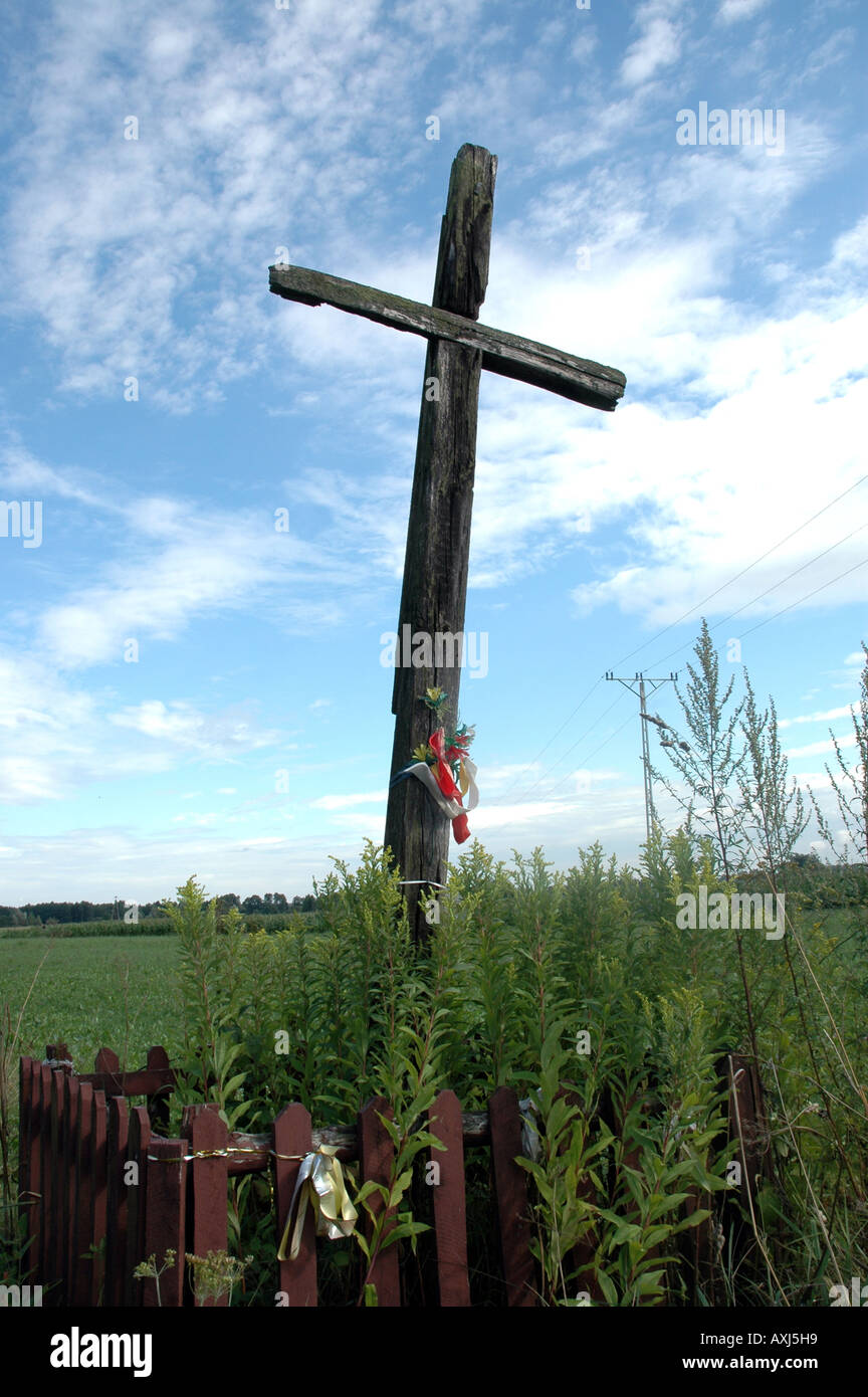 Wooden wayside cross on polish country Stock Photo