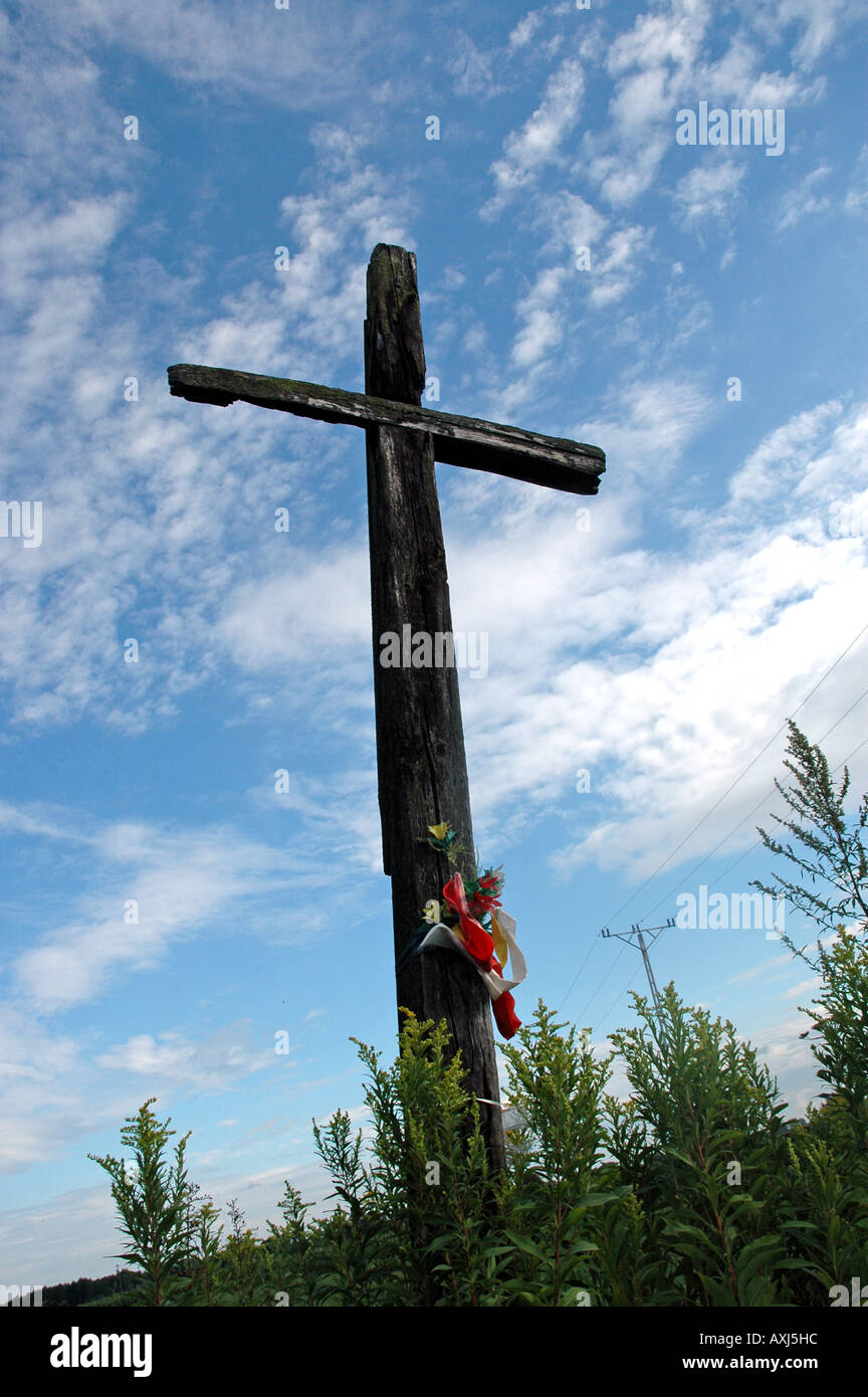 Wooden wayside cross on polish country Stock Photo