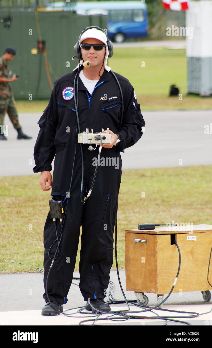 Guy Dekel of the Israeli army pilots an unmanned aerial vehicle (UAV) with radio control equipment, flying over Singapore. Stock Photo