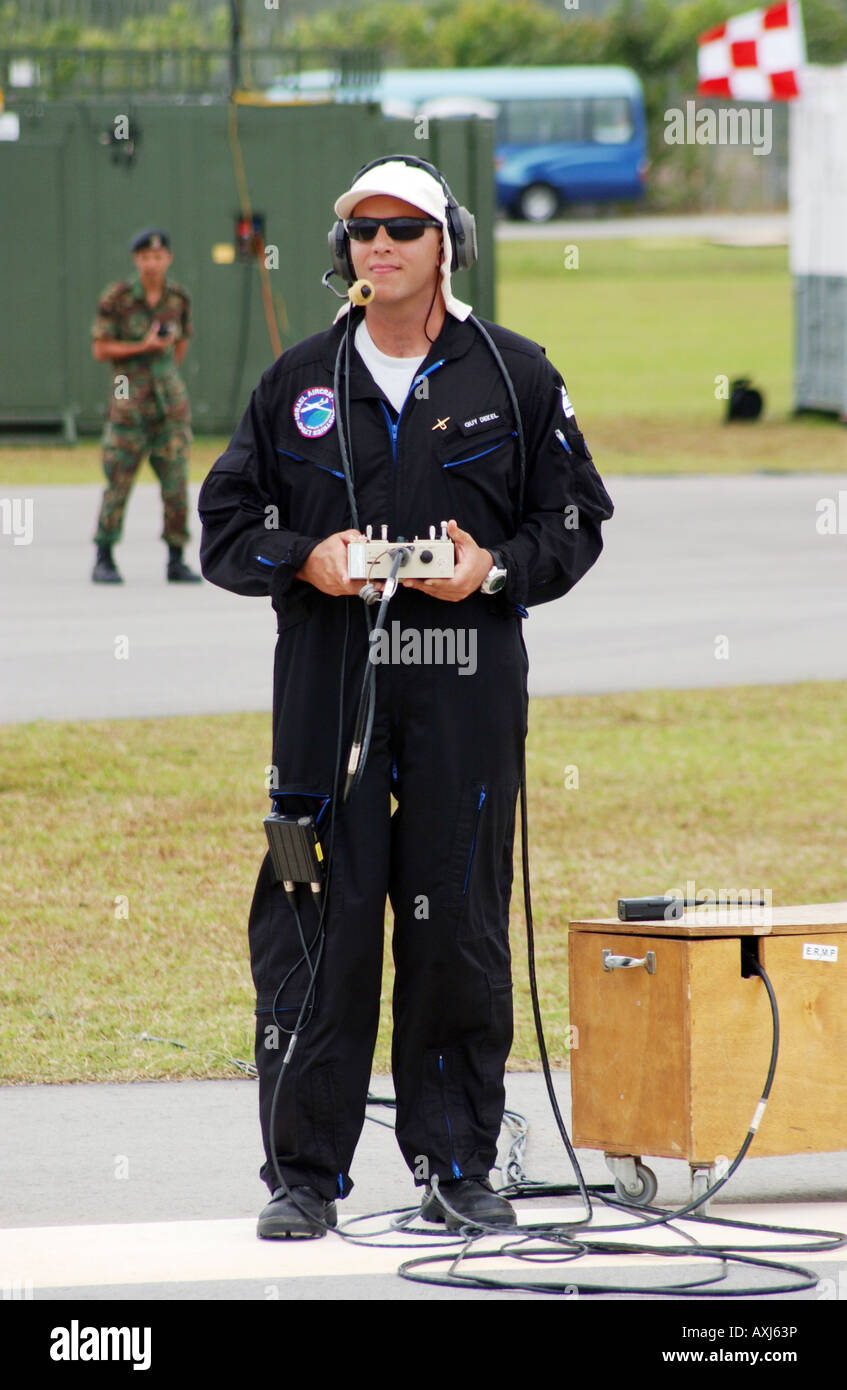 Guy Dekel of the Israeli army pilots an unmanned aerial vehicle (UAV) with radio control equipment, flying over Singapore. Stock Photo