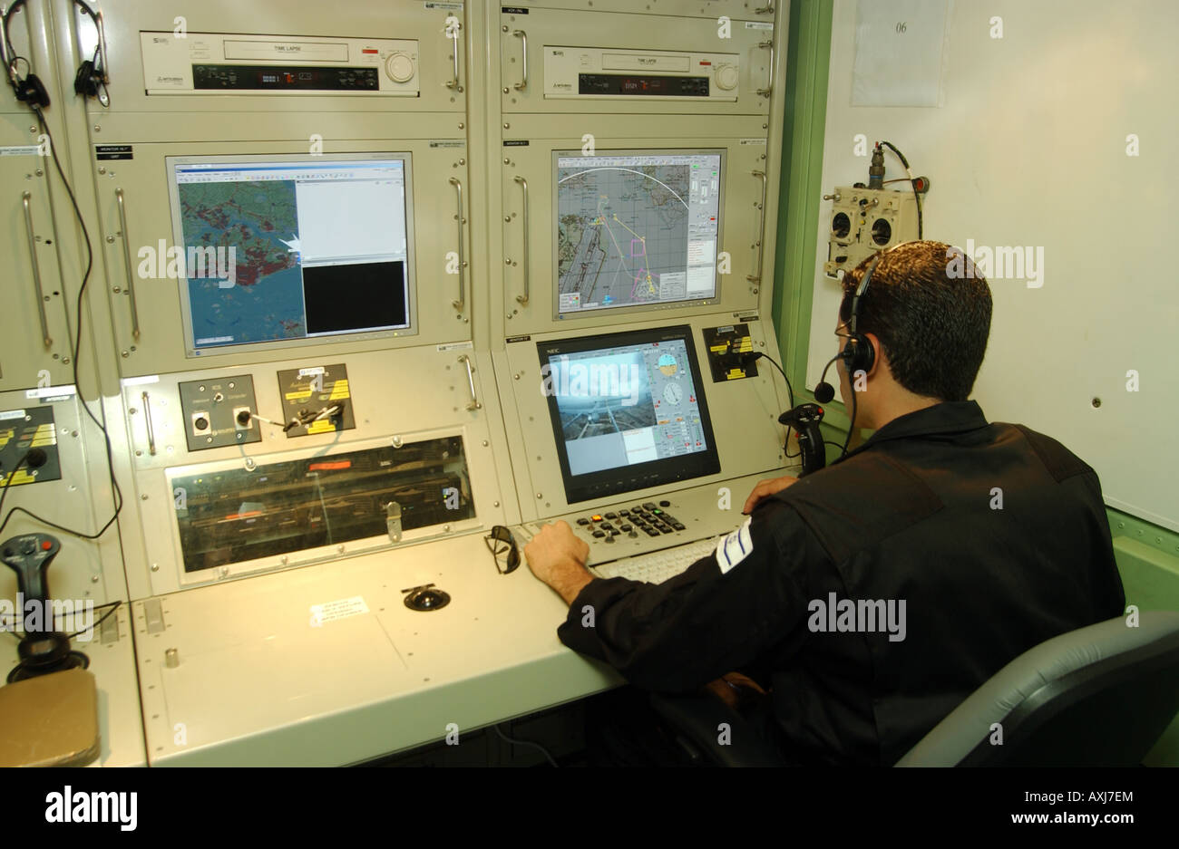 Tomer Koriat of the Israeli army monitors the data sent back by an unmanned aerial vehicle (UAV) flying over Singapore. Stock Photo