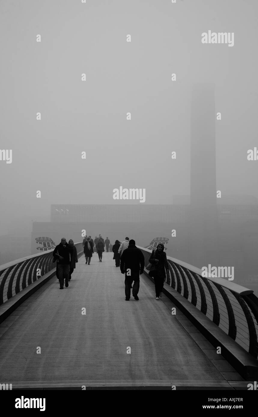 Fog-shrouded Millennium Bridge and Tate Modern, Bankside, London Stock Photo