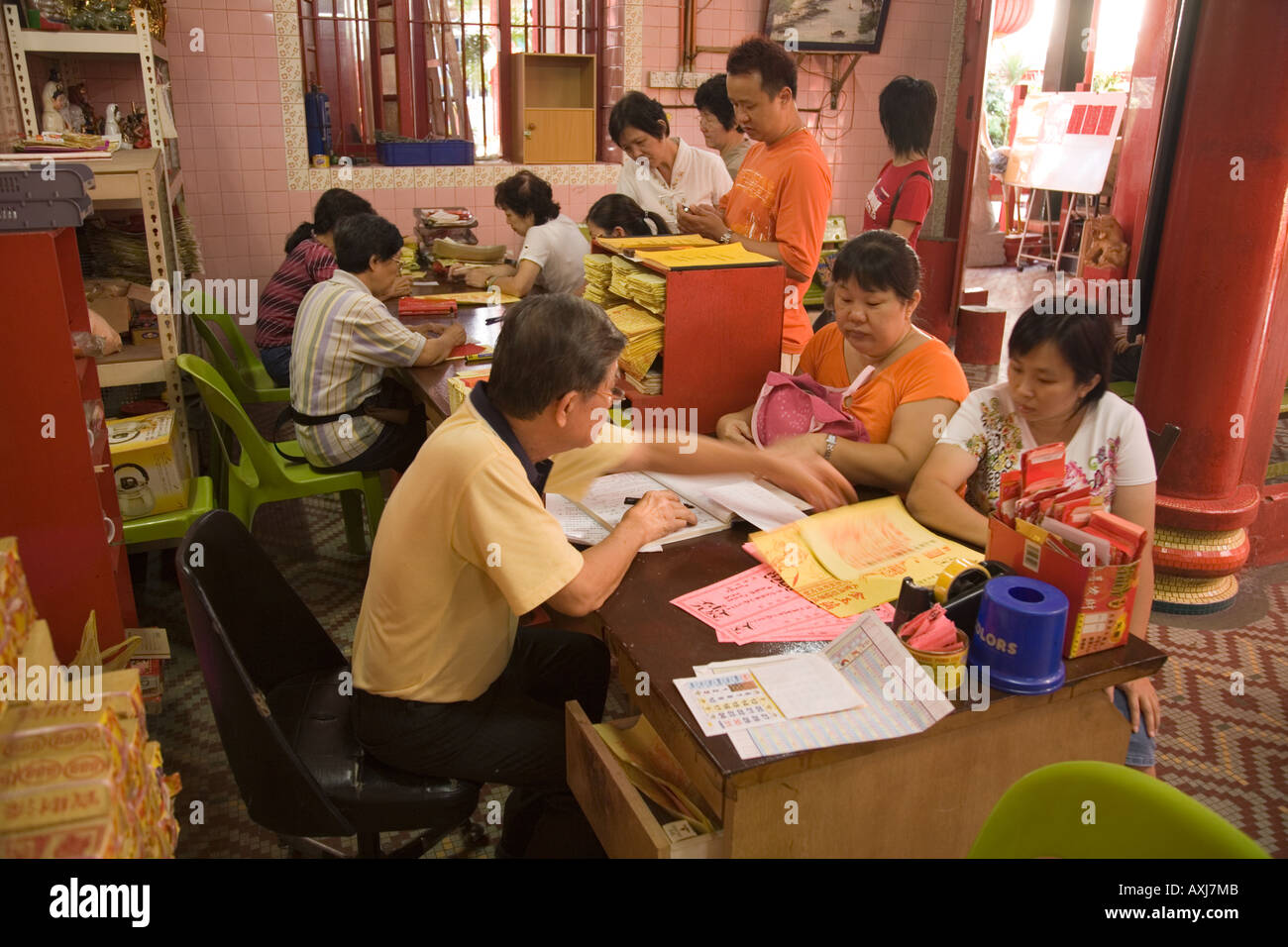 Fortune tellers and customers in Chinese temple Kuala Lumpur Malaysia