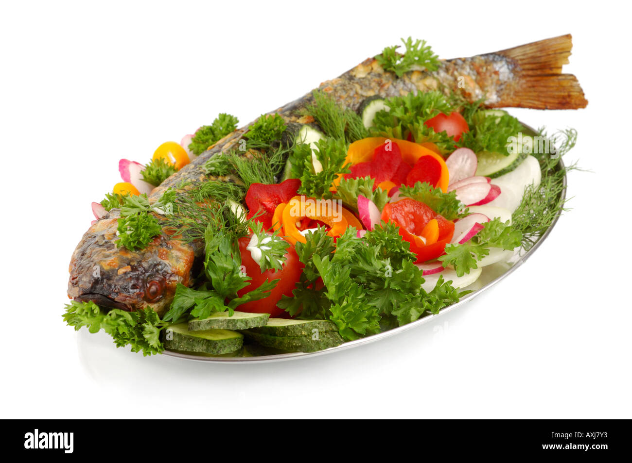 Appetizing baked mullet with vegetables Stock Photo