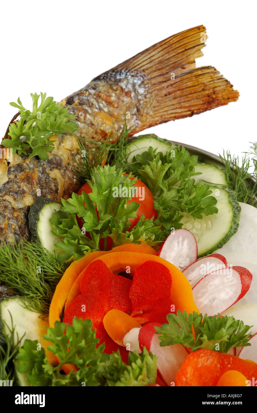Baked fish with vegetables Stock Photo