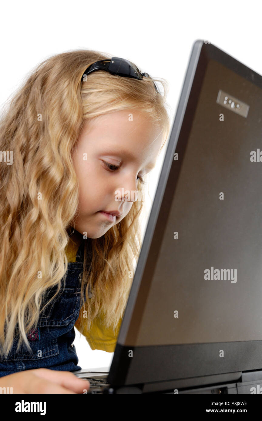 Little girl working on laptop Stock Photo Alamy
