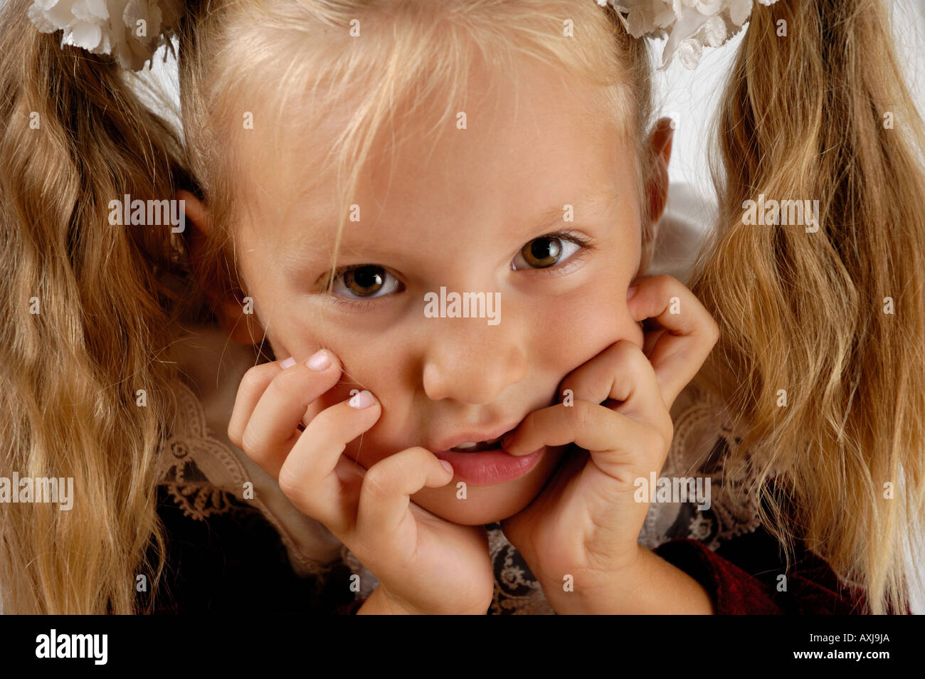Funny little girl expressive close up portrait Stock Photo
