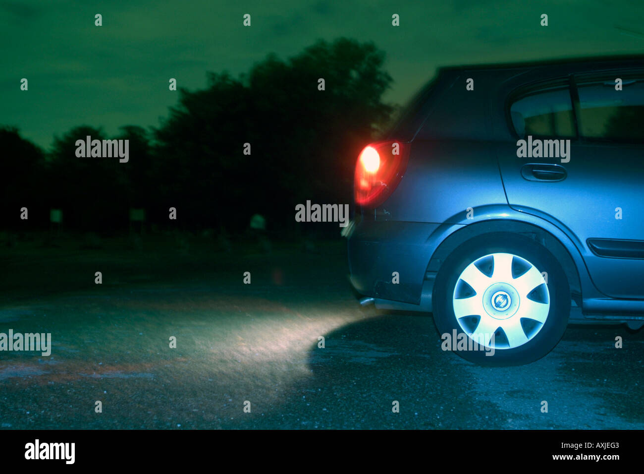 Vehicle rear at night with brake lights on Stock Photo Alamy