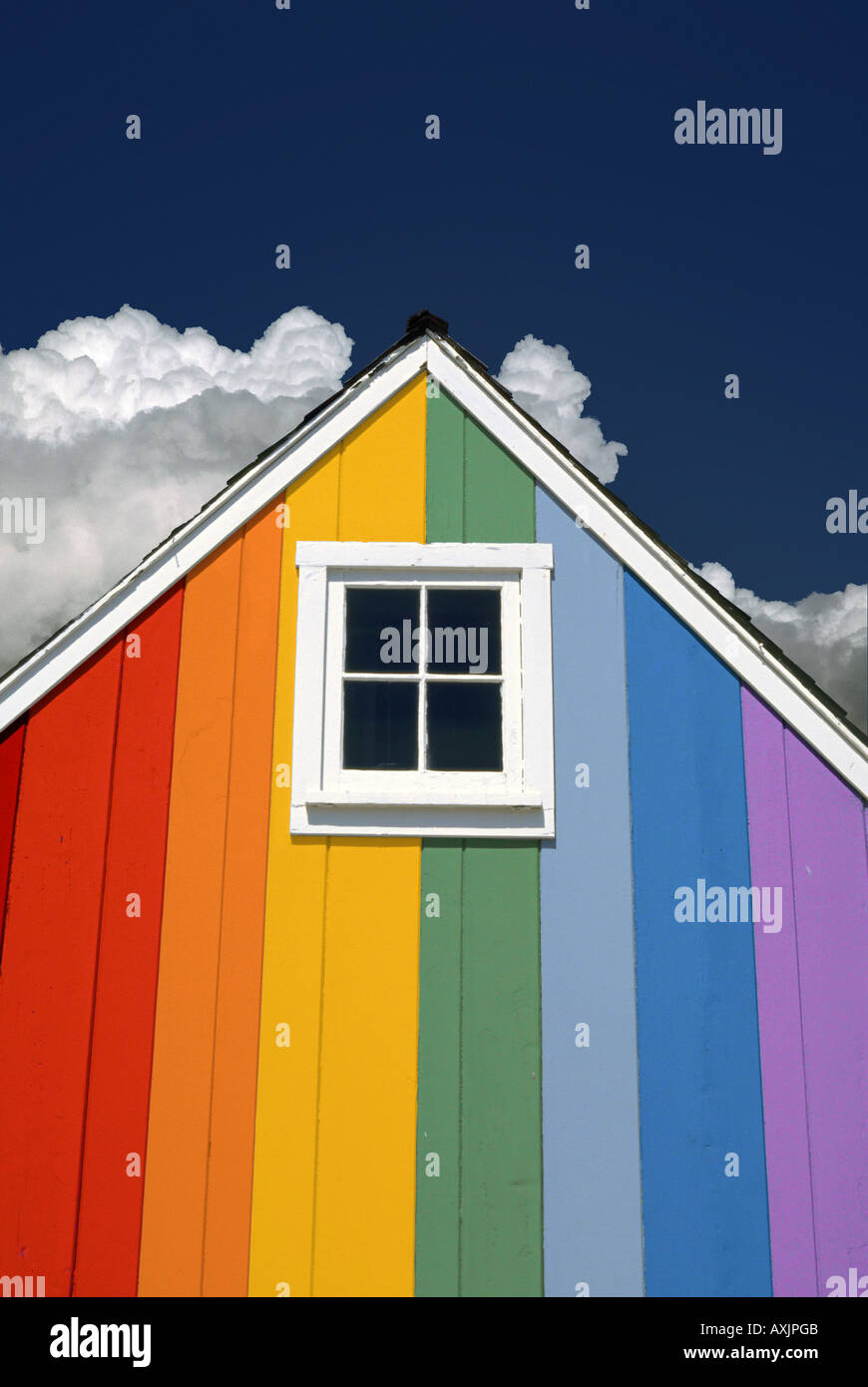 Little rainbow house gable with white square little window Stock Photo
