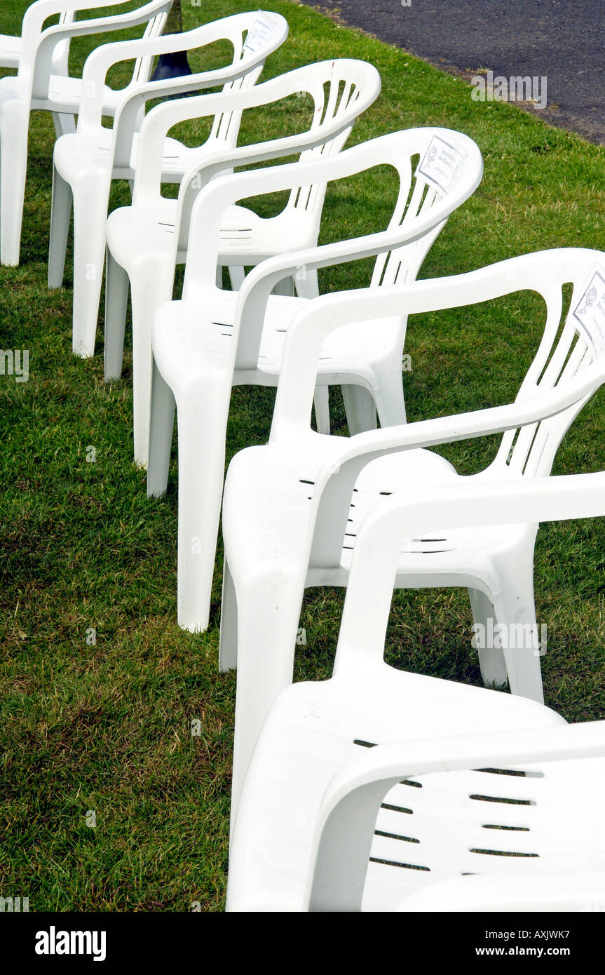 Row of white plastic chairs Stock Photo Alamy