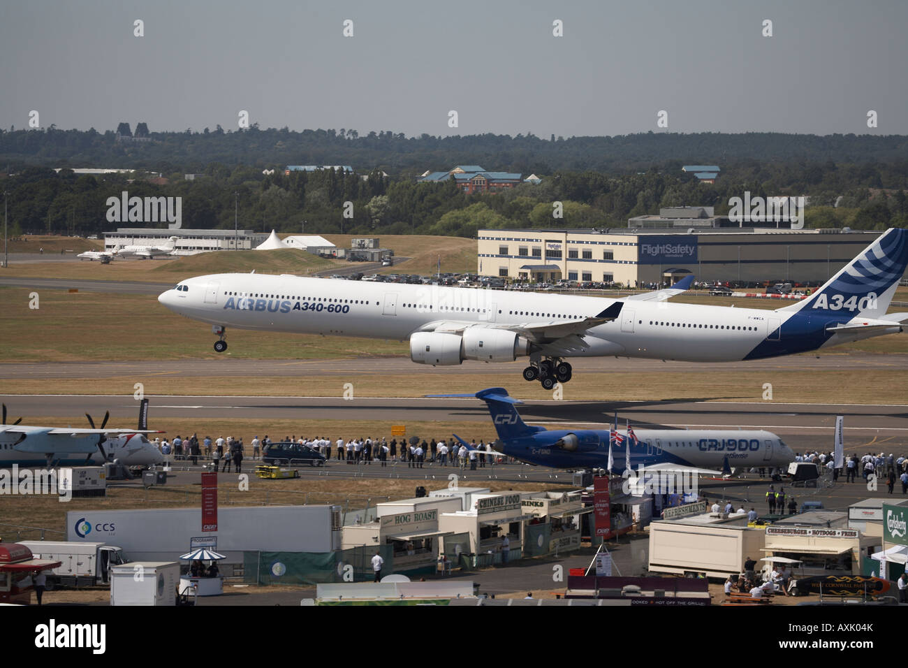 Airbus A340 600 aircraft landing on display at Farnborough International Airshow July 2006 About to touch down after its flying Stock Photo