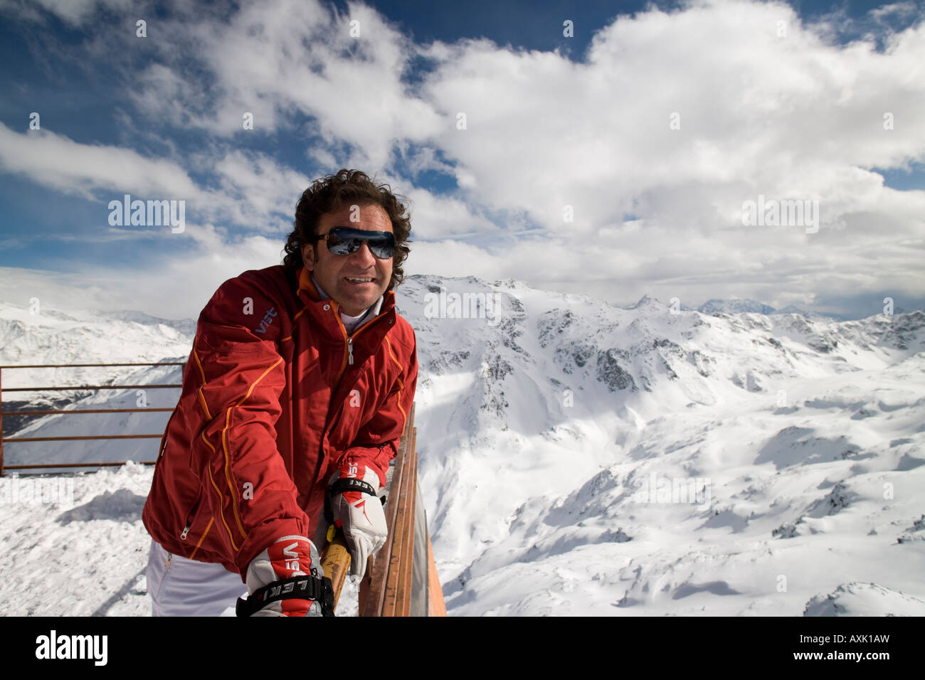 Handsome man Italian style wearing ski sportswear on top of cimino mountain  in the Alps, Bormio, Italy Stock Photo - Alamy