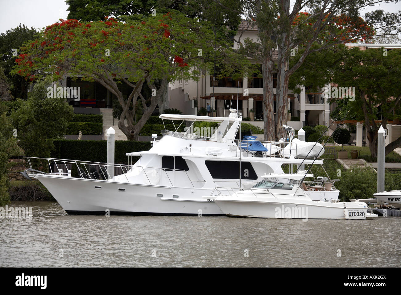 Expensive house or residential property overlooking river with motor