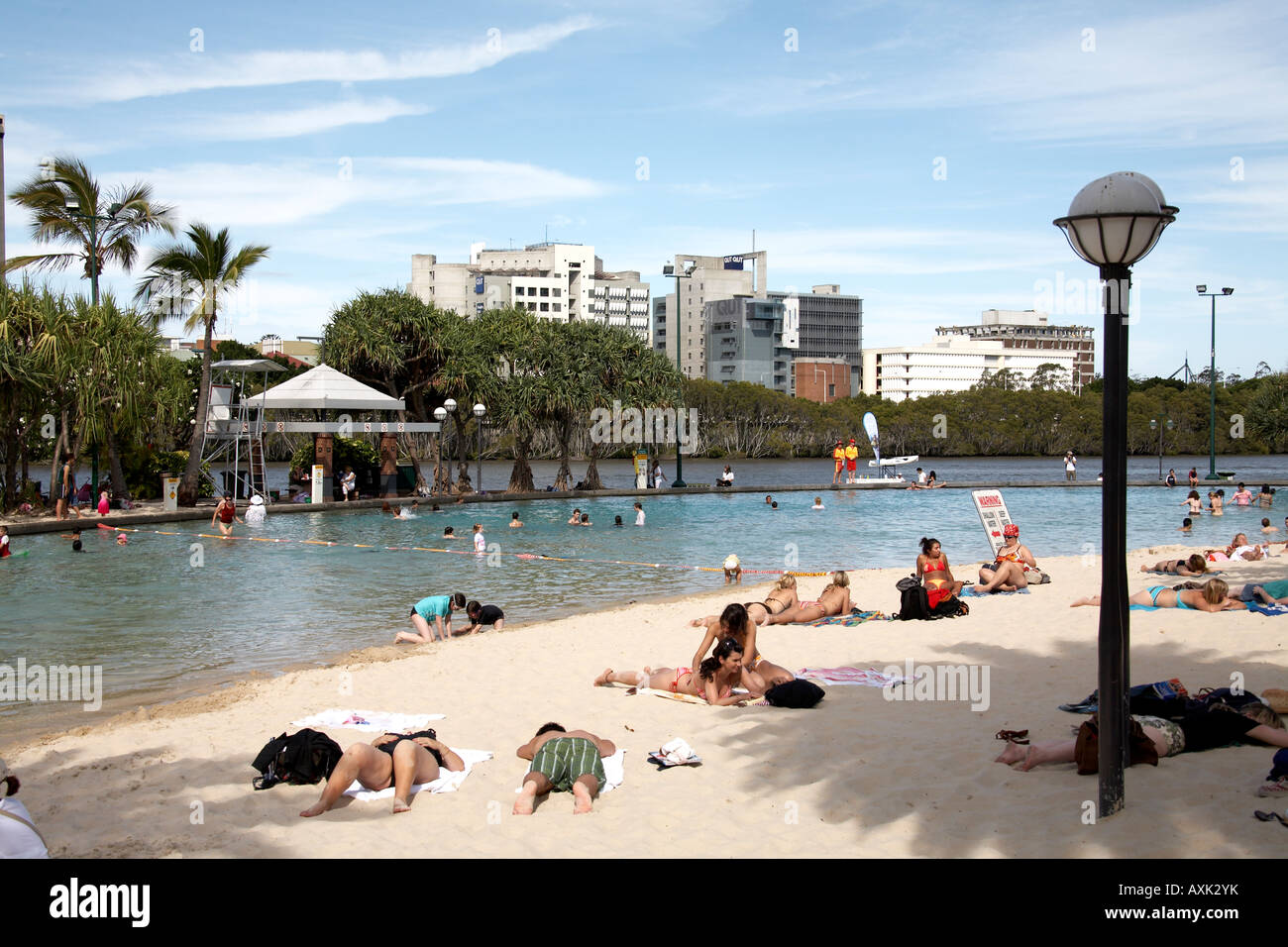 People swimming and sunbathing by artificial Streets beach on South