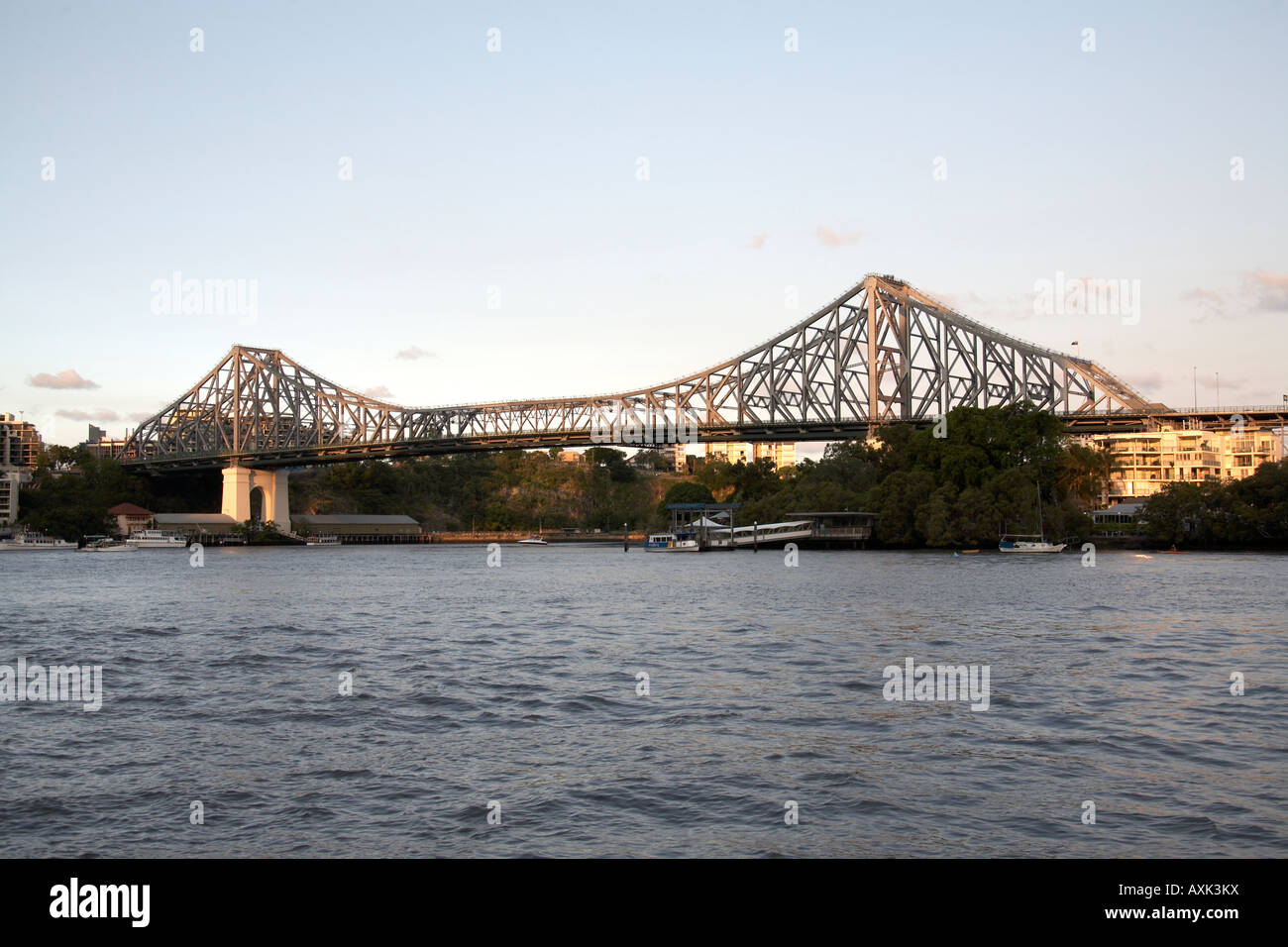 Story Bridge steel truss in evening summer sunlight with river Brisbane Queensland QLD Australia Stock Photo