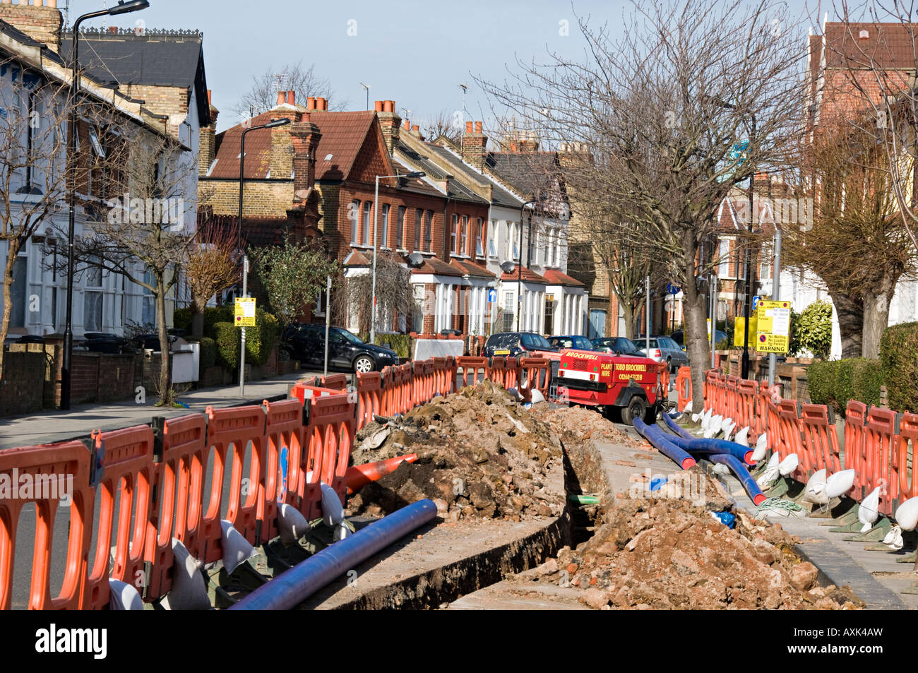 Replacing old water pipes in residential road Wood Green London Stock