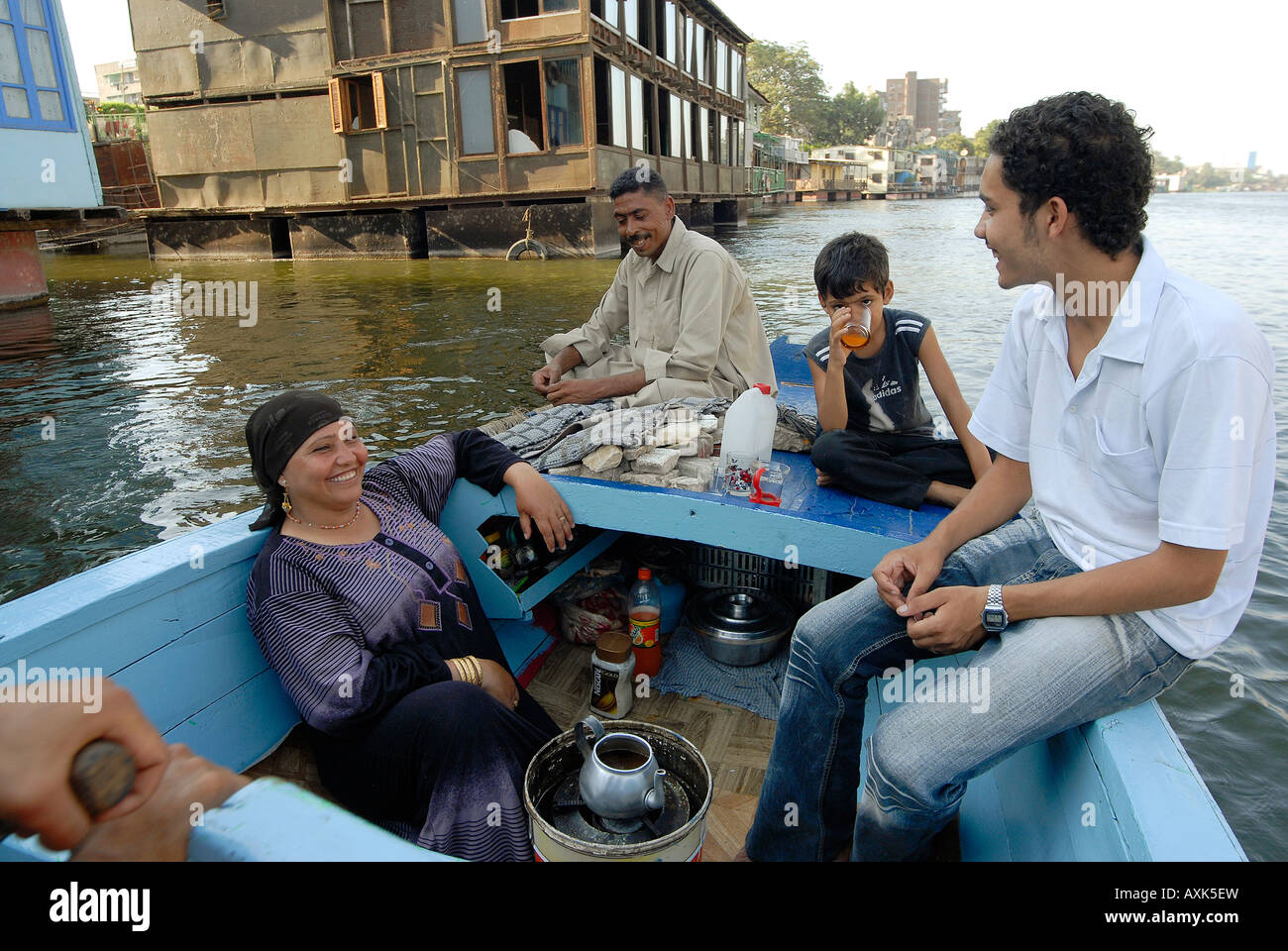 Family living on a rowing boat having a tea Stock Photo