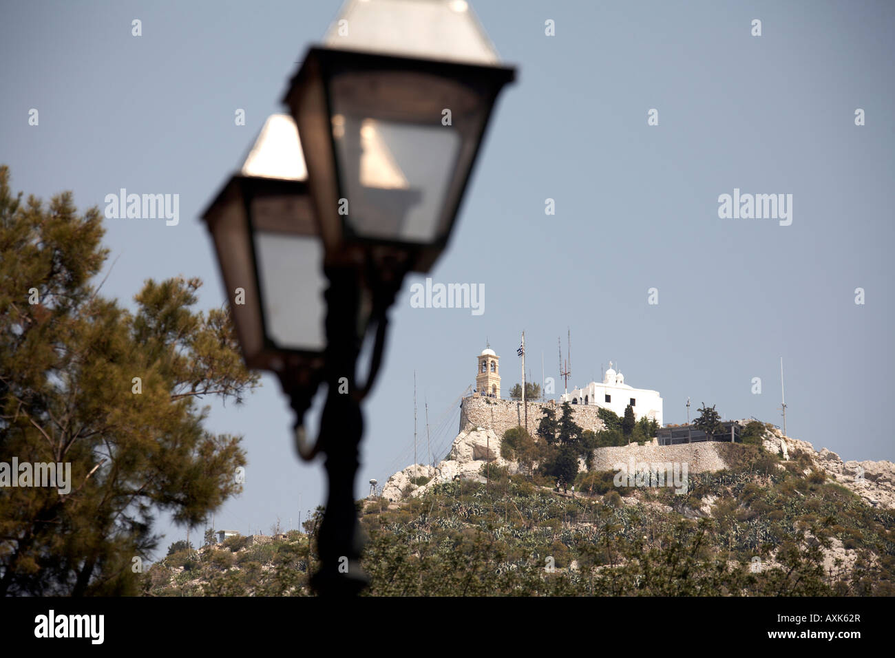 Likavitos or Lycabbetus hill with Agios Georgios greek orthodox church and decorative street lamps in Athens or Athini Greece Stock Photo